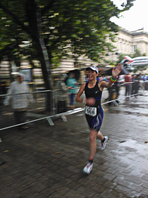 A photograph of Robyn Hawxby running in an ironman event.