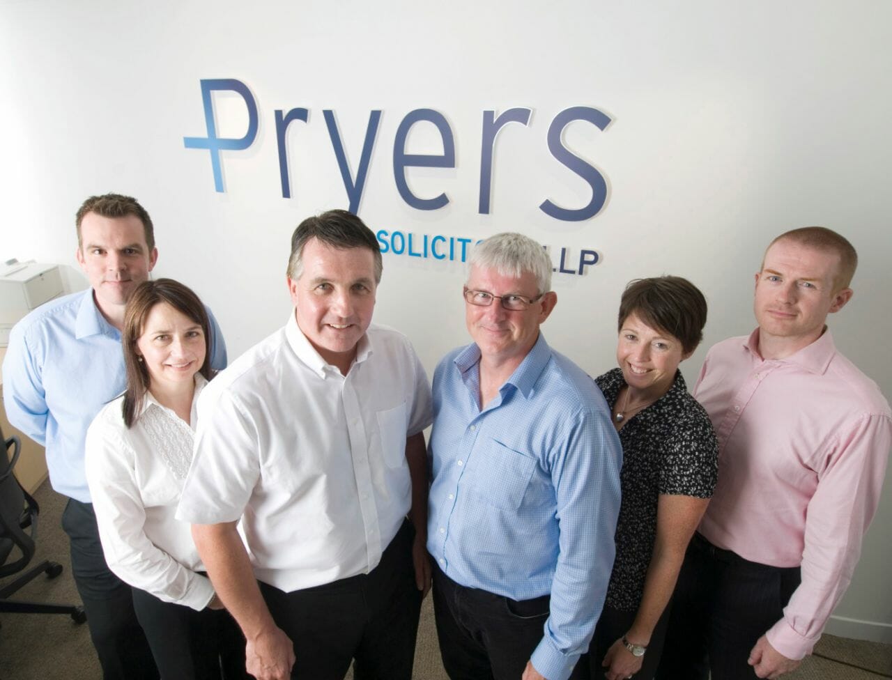 A photograph of the new partners at Pryers Solicitors, with Ian Pryer and Time Gorman