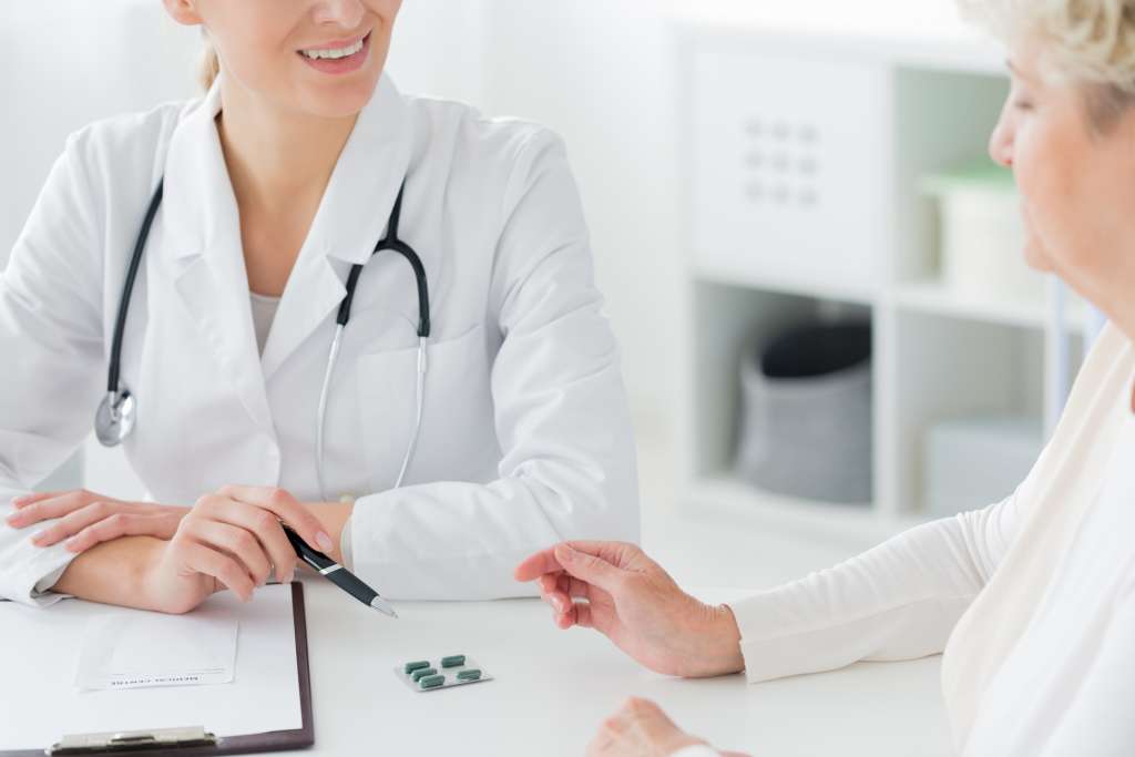 doctor prescribing medication to patient