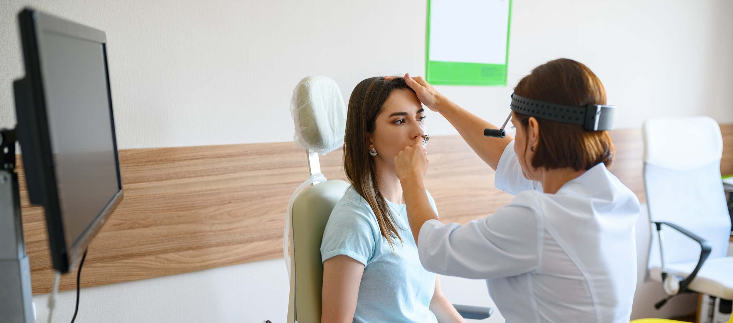 female-doctor and patient examing nose