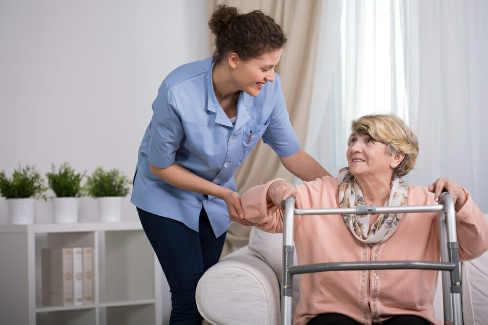 A nurse caring for an elderly lady