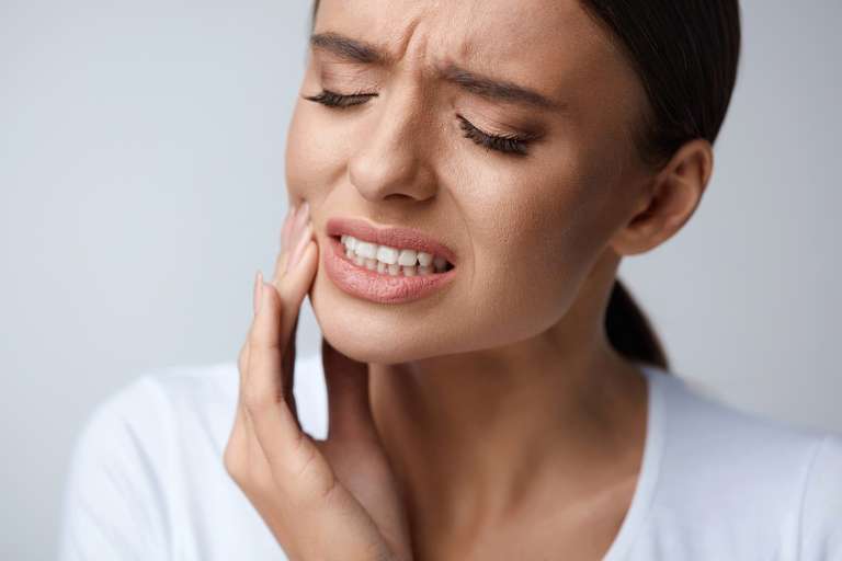 Woman with tooth ache