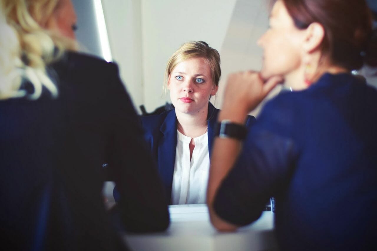 A photograph of a person being questioned in an interview to depict recruitment. Support an article about the NHS struggling to recruit and fill nursing jobs.