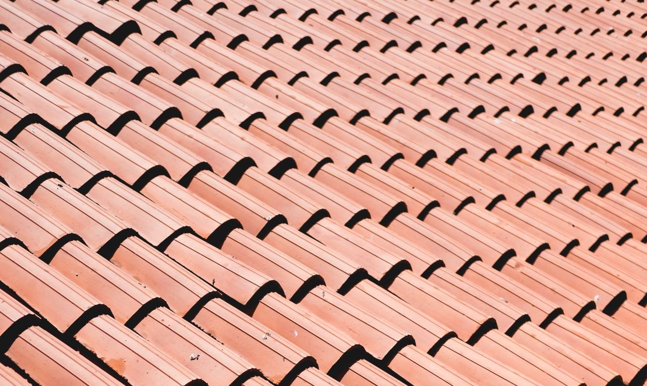 A photograph of a tiled roof. To depict the 'same roof' rule which the CICA have now abolished.