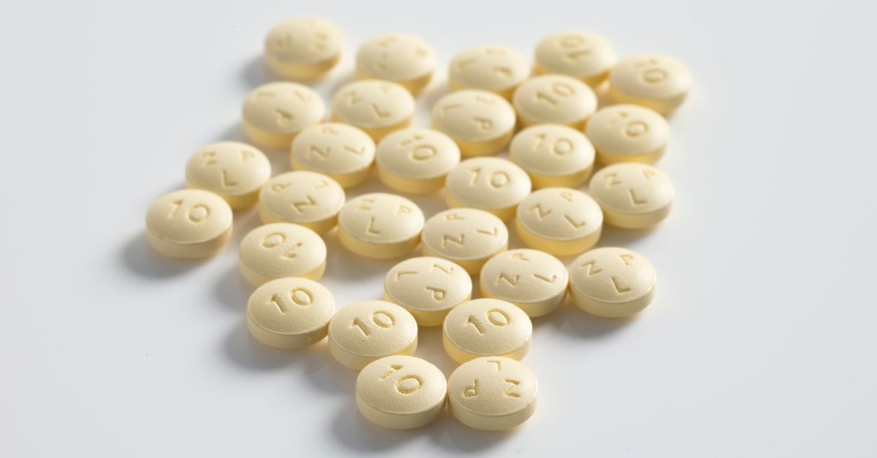 Yellow tablets on a white surface