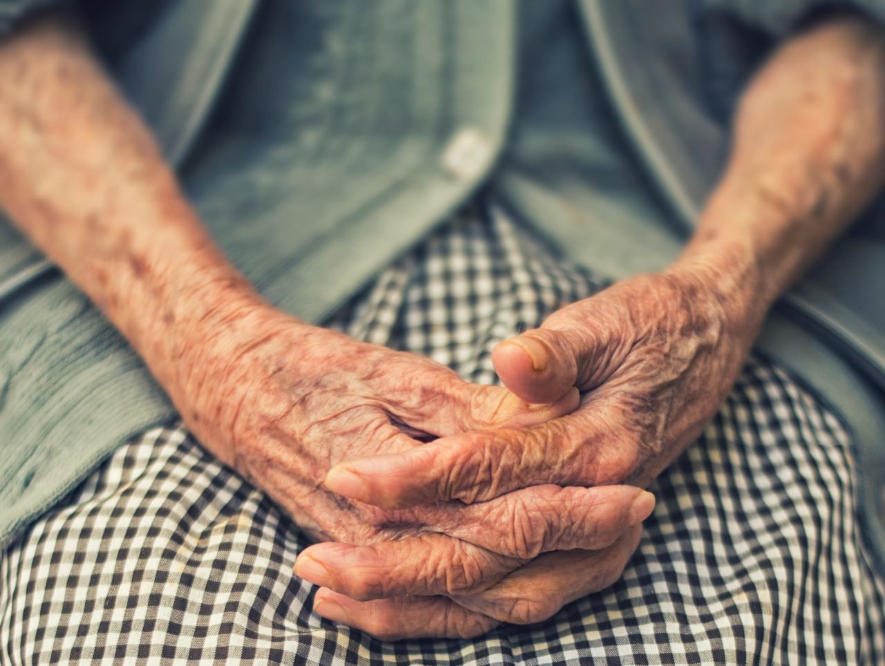 An elderly person's hands