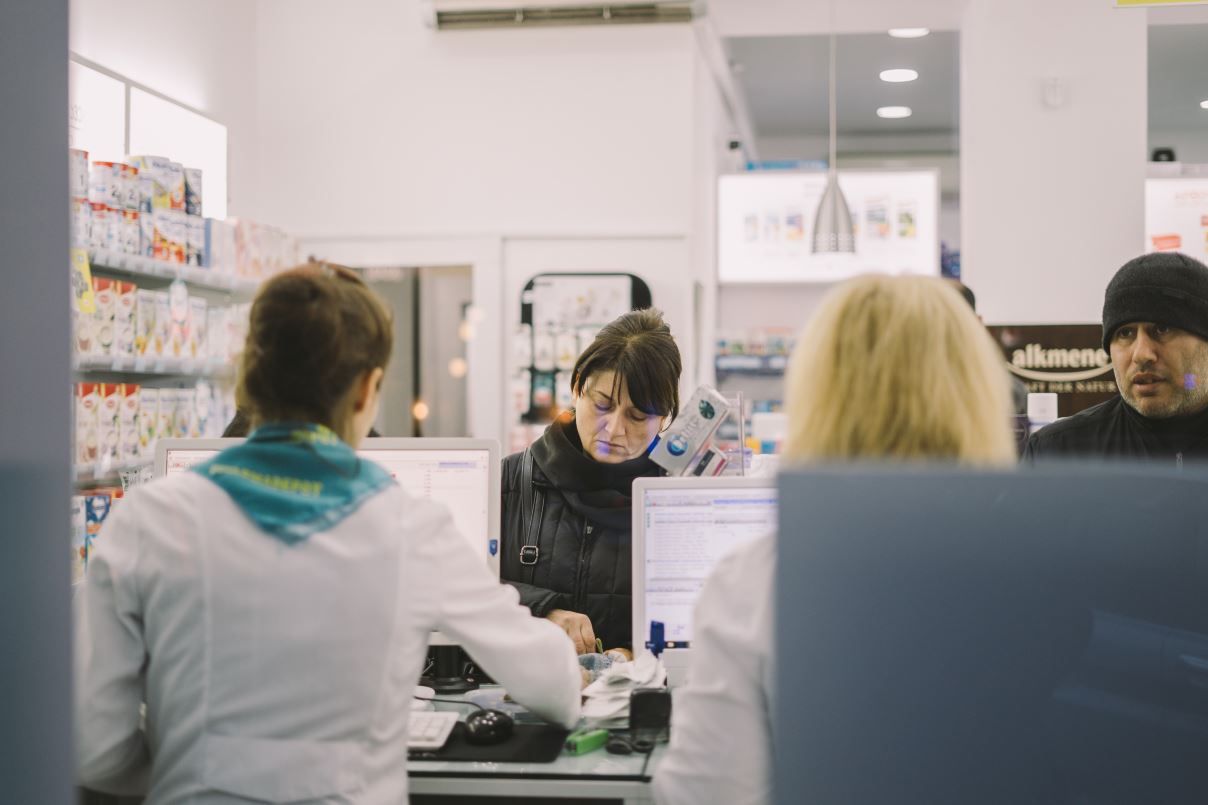 Lady being served in a pharmacy. The DHSC has announced that pharmacies will treat minor health issues from October 2019.