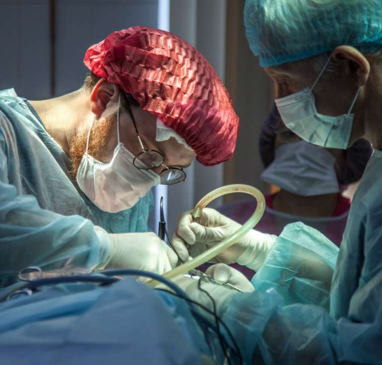 A photograph of a surgeon carrying out cosmetic surgery.