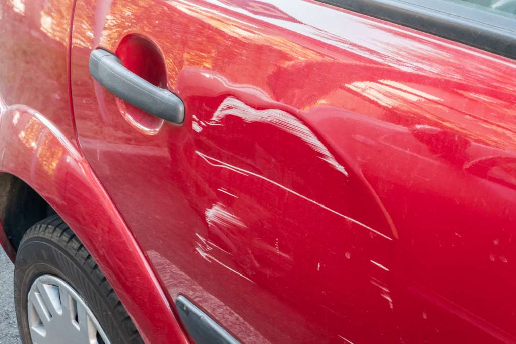 Scratches on the red car