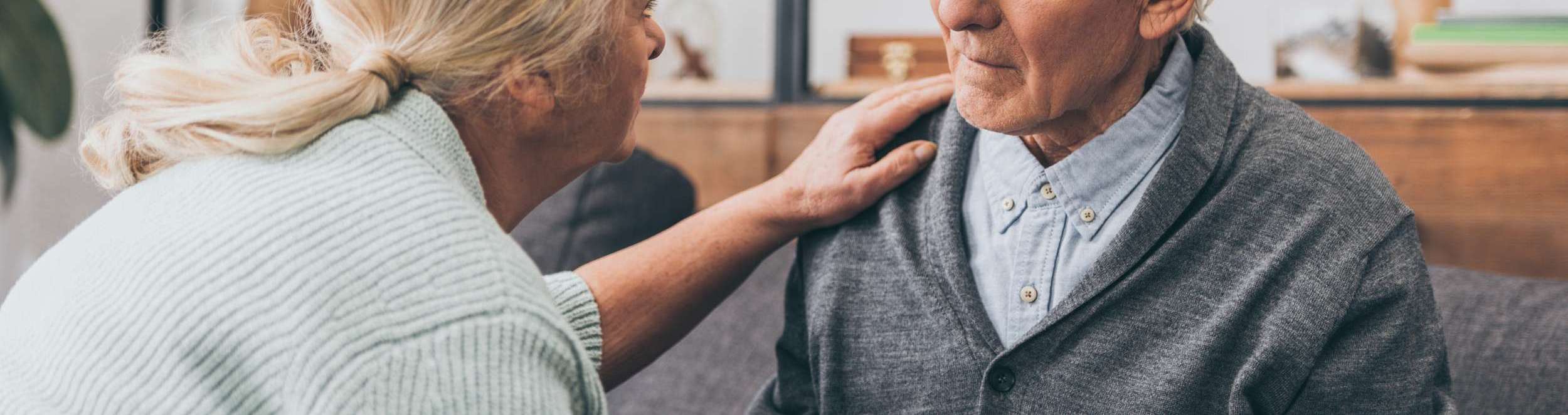 comforting elderly man