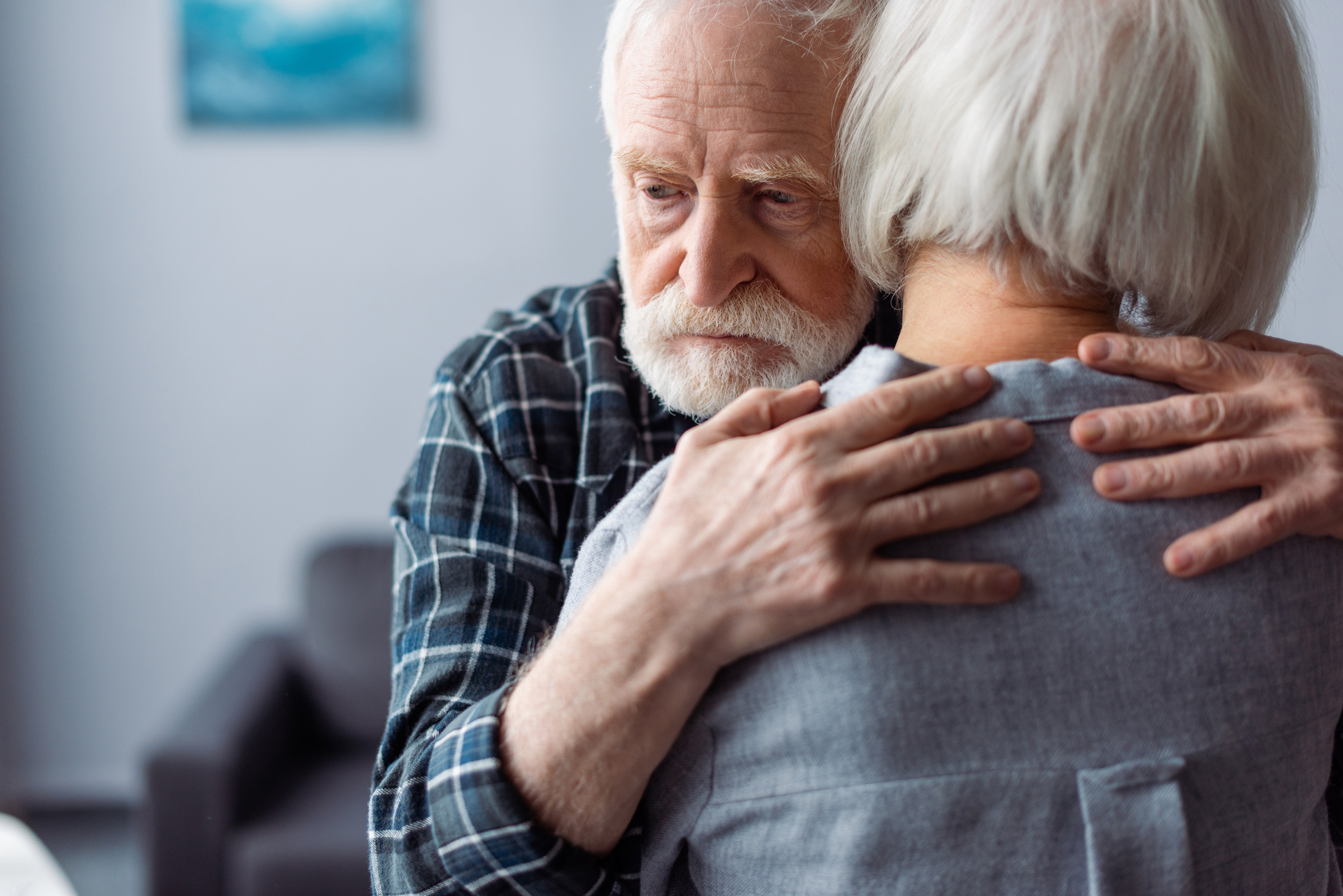 woman hugged by husband