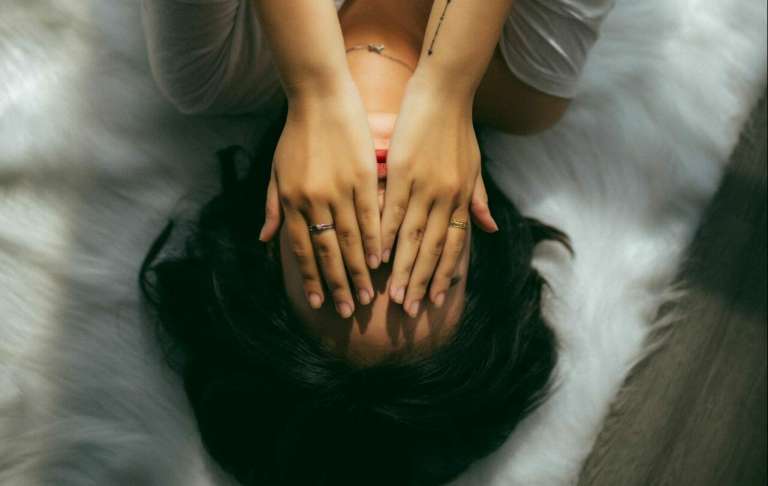 A photo of a woman with brain injury, in despair and lonely. One of the consequences of lockdown for brain injury survivors