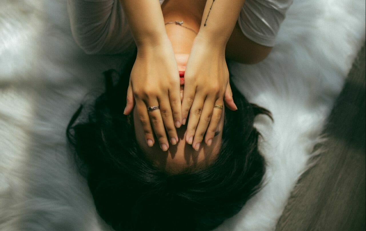 A photo of a woman with brain injury, in despair and lonely. One of the consequences of lockdown for brain injury survivors