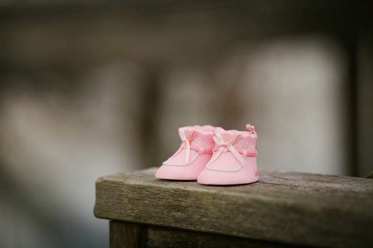A photograph of a pair of pink baby shoes to mark birth trauma awareness week.