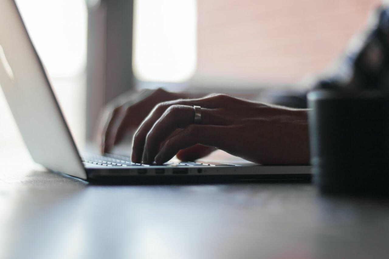 A photograph of someone typing on a laptop keyboard. To depict making a complaint. The NHS Complaints Standards Frameworks will look to improve the system.