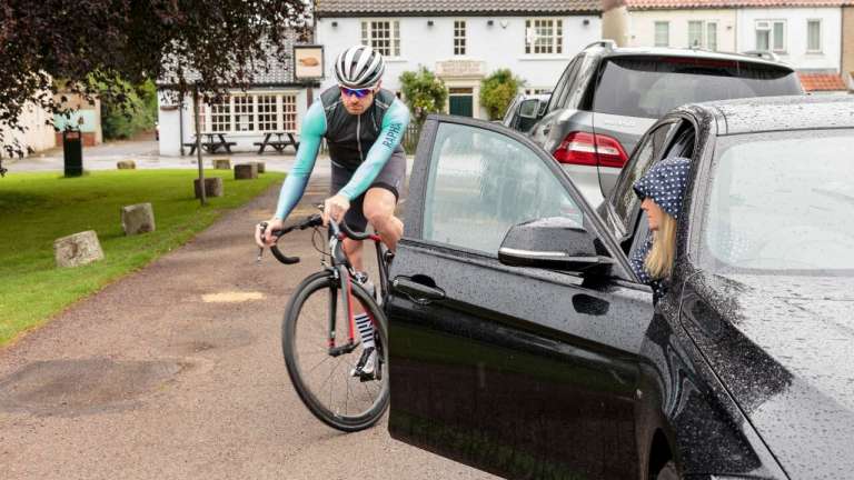 Cyclist hit by car door