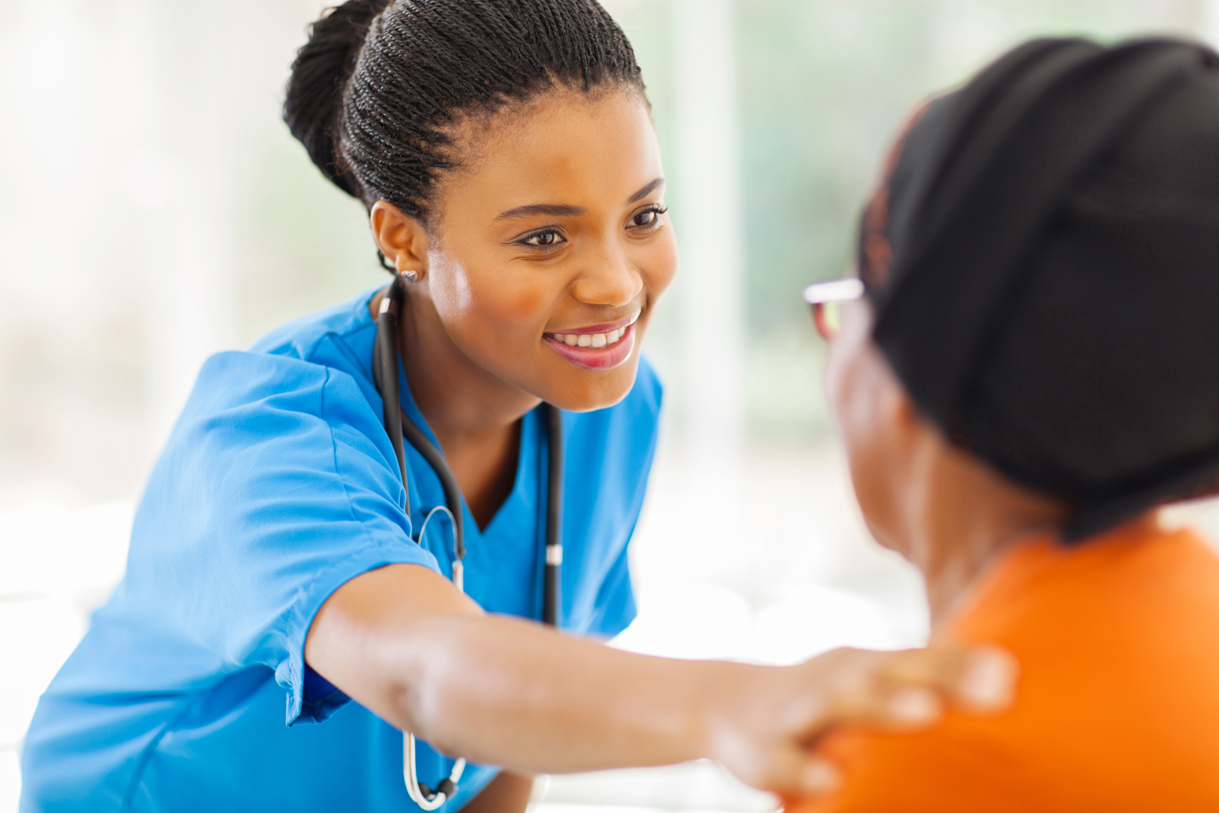 Nurse comforting patient