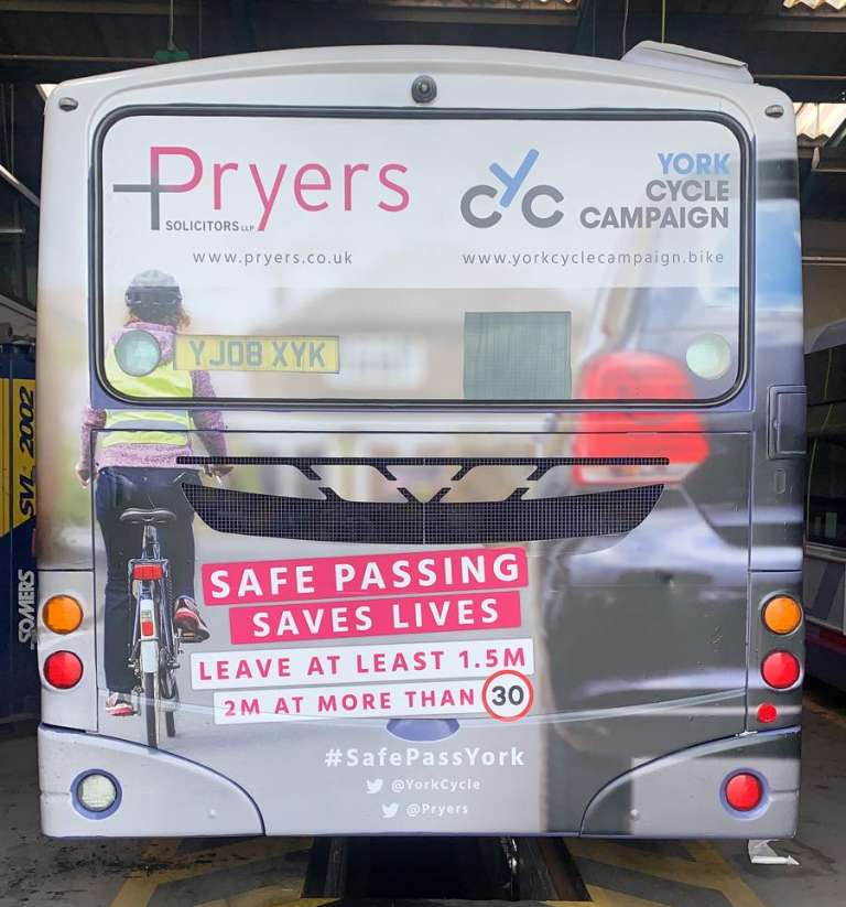 A photograph of Pryers Solicitors and York Cycle Campaign's bus advert to promote safe passing