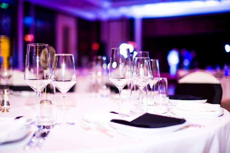 A photograph of a formal dinner table setup